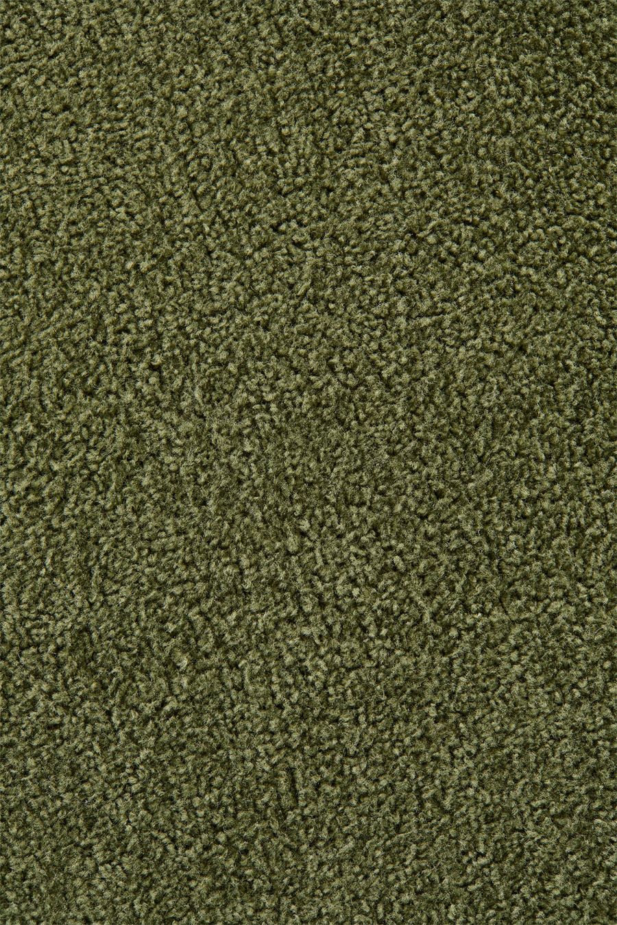 Gros plan du tissu bouclette vert olive du canapé Mati.