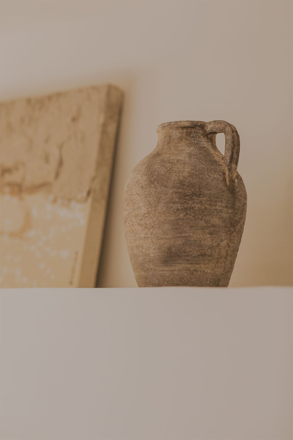 Jarrón de cerámica rústico con asa