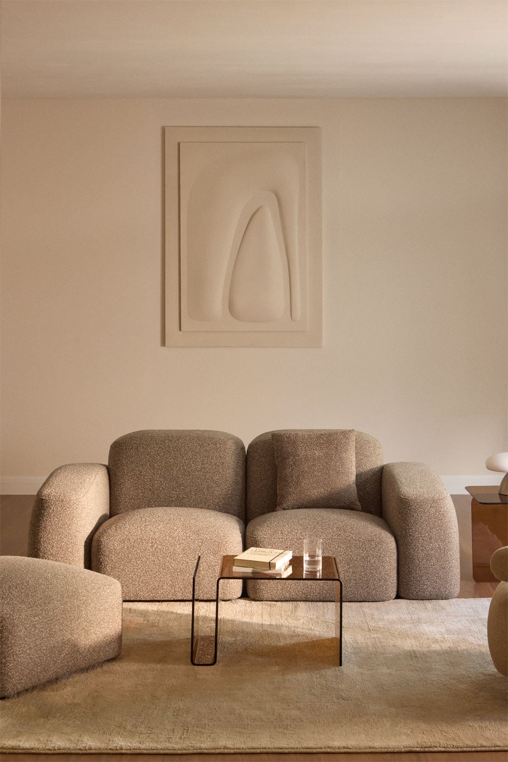 Sofá modular Bastian de 2 plazas con puff en tejido bouclé beige