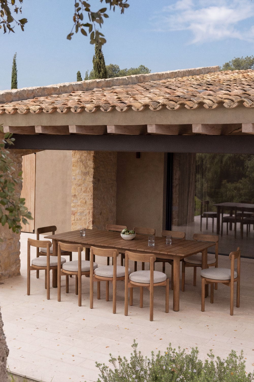 Conjunto de comedor para exterior de madera de teca