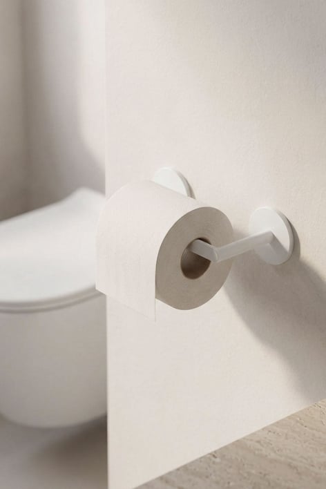Portarrollos adhesivo para baño en acero inoxidable Caldrumi