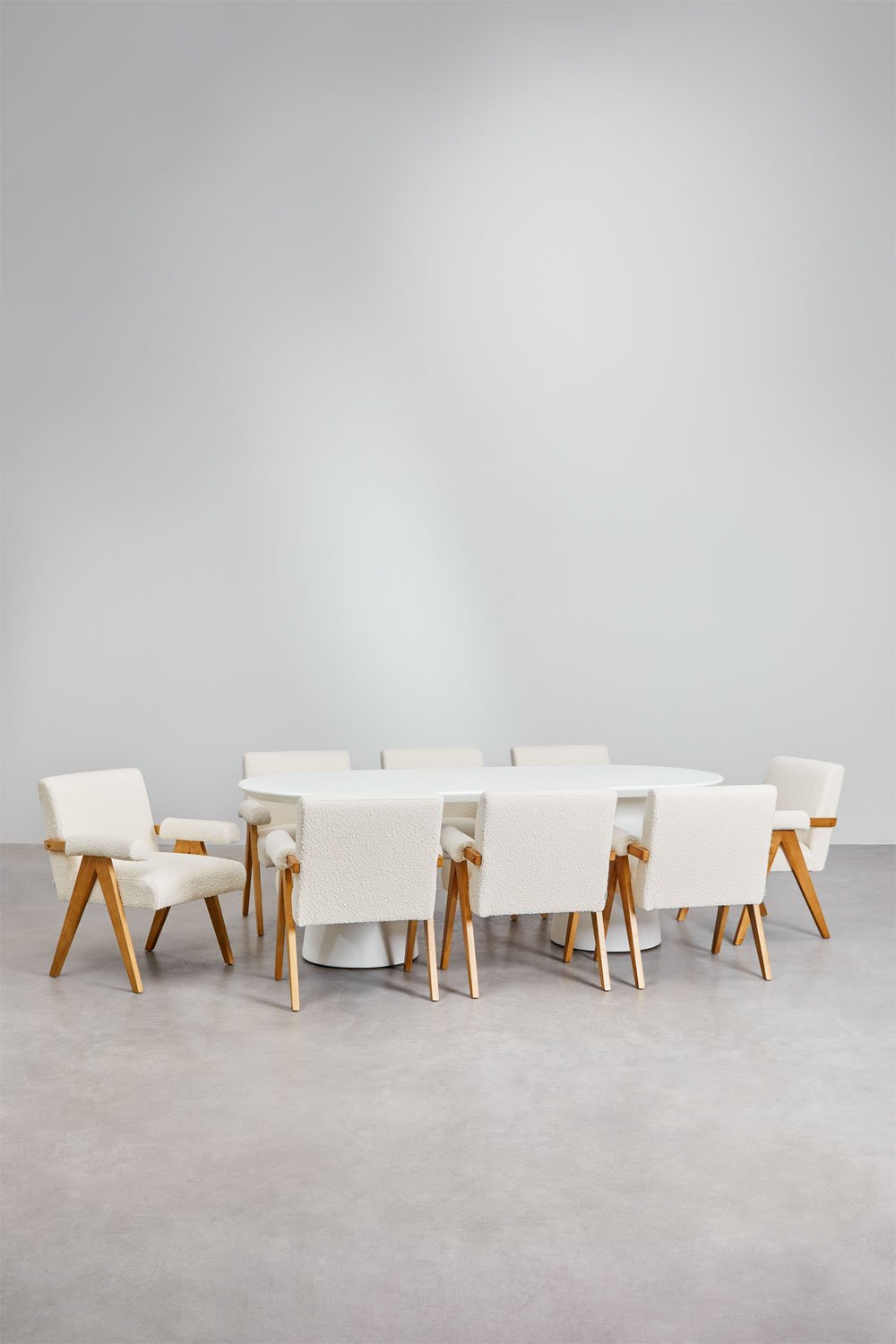 Set de mesa de ovalada (220x95 cm) en cemento Noemi y 8 sillas de comedor en madera de fresno y tela bouclé Lucca , imagen de galería 1