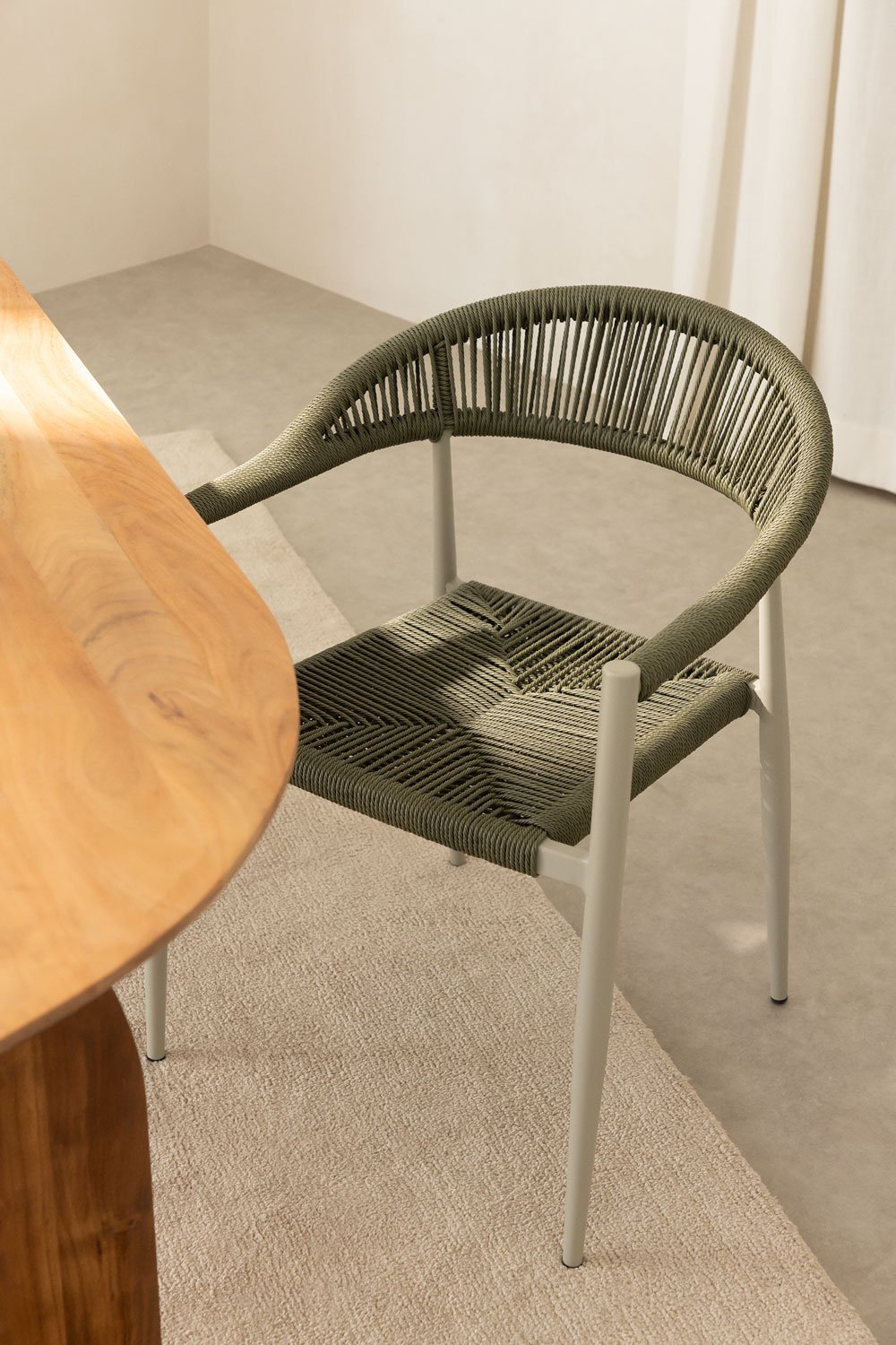 Stackable dining chair with armrests in aluminium and synthetic rattan Amatria, gallery image 1