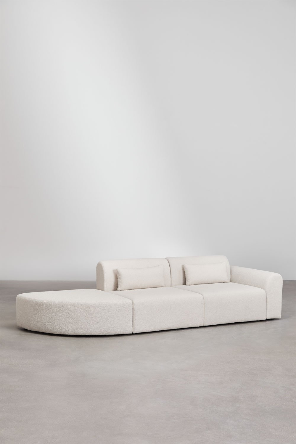 2-piece modular corner sofa on the right with a triangular pouf in Borjan sheepskin, gallery image 2