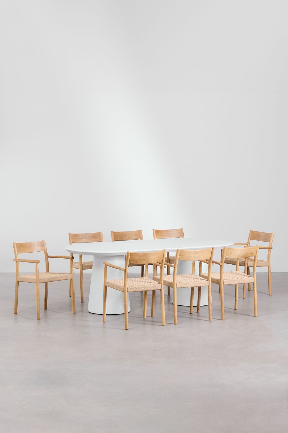 Set of oval cement table (220x95 cm) Noemi and 8 dining chairs in oak wood and braided rope Mara, gallery image 1