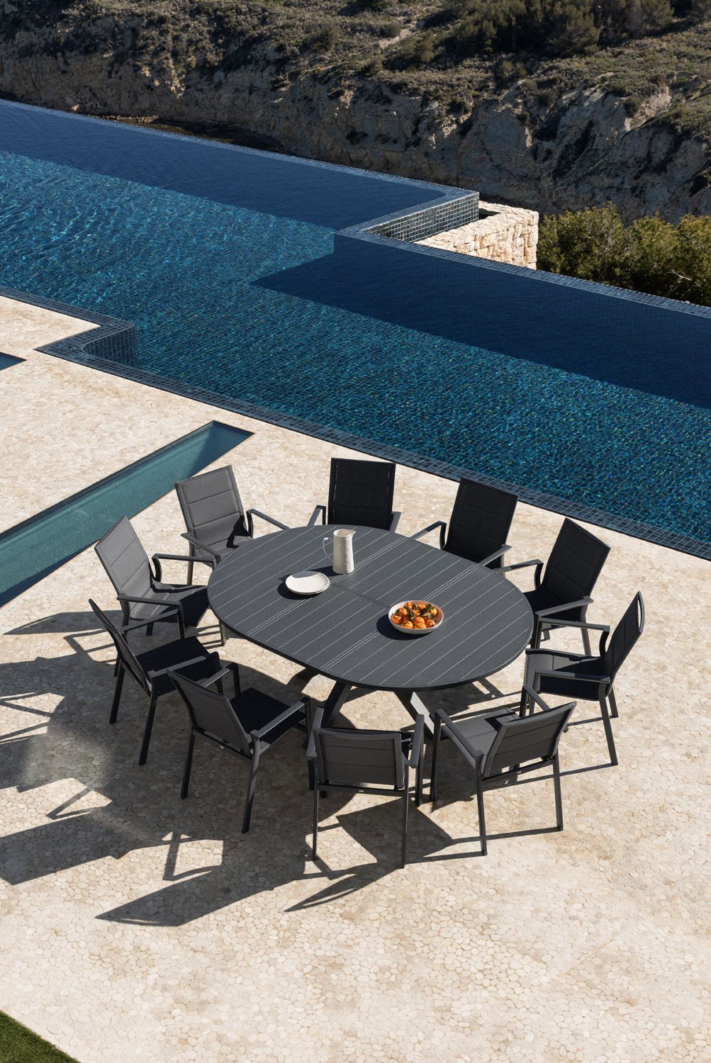 Barces extendable table set 145-200x145 cm and 10 stackable garden chairs with armrests in aluminum Karena, gallery image 1