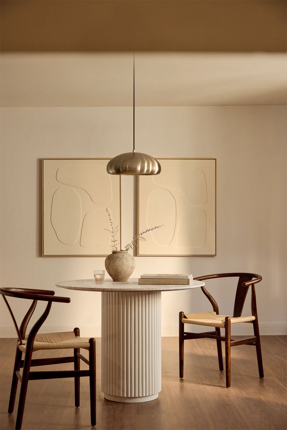 Giselda round dining table in natural stone and mango wood, gallery image 1