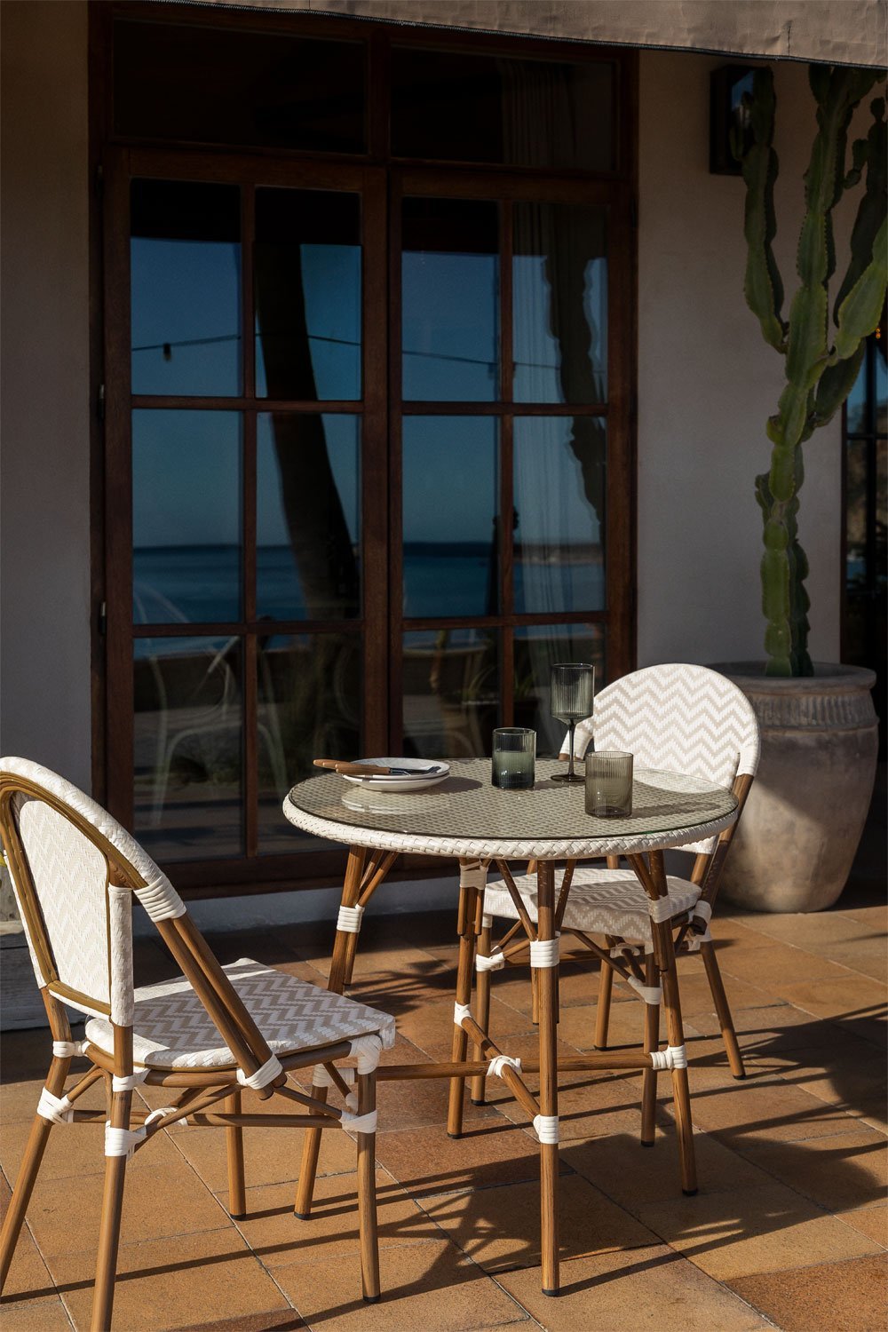 Brielle Bistro round table set, Ø80 cm, and two stackable garden chairs in aluminium and synthetic rattan., gallery image 1