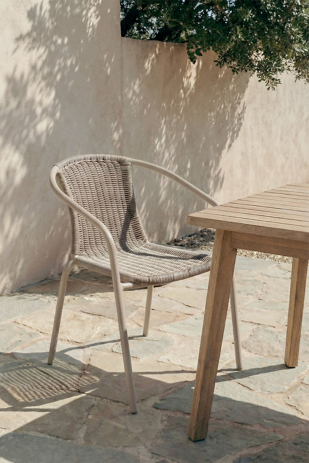 Stackable garden chair with steel armrests and synthetic rattan Kalymana, gallery image 1