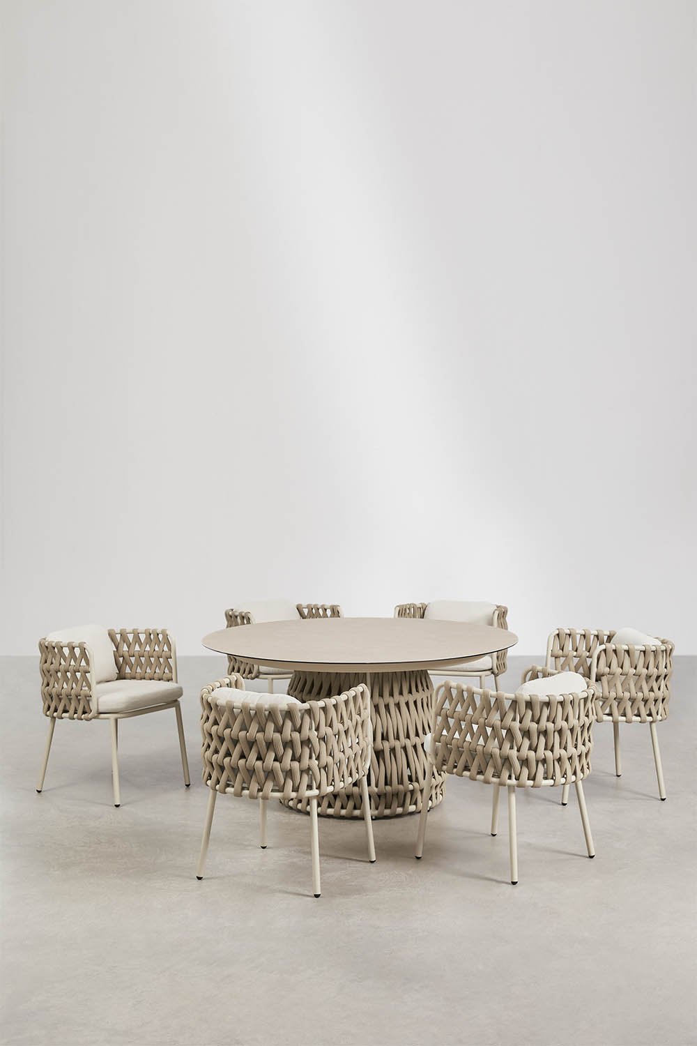 Round table set Ø140 cm in ceramic and 6 garden armchairs in aluminum and braided rope Tevary, gallery image 1
