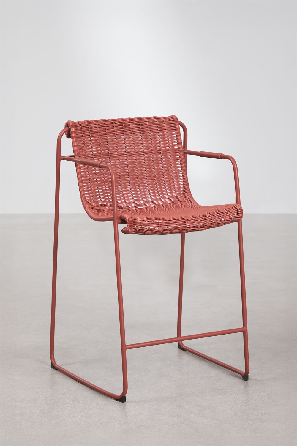 Stackable high garden stool with armrests in synthetic rattan and steel Revia, gallery image 1