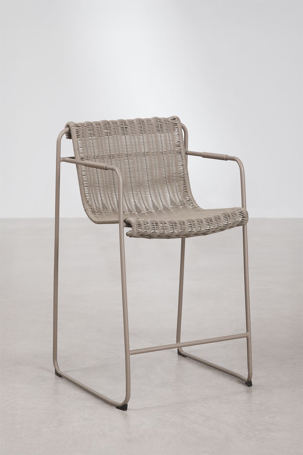 Stackable high stool with armrests in synthetic wicker and steel Revia, gallery image 1