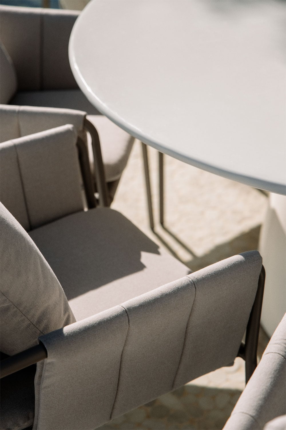 Numira Ø150 cm round cement table set and 8 upholstered garden armchairs in Zunika steel, gallery image 2