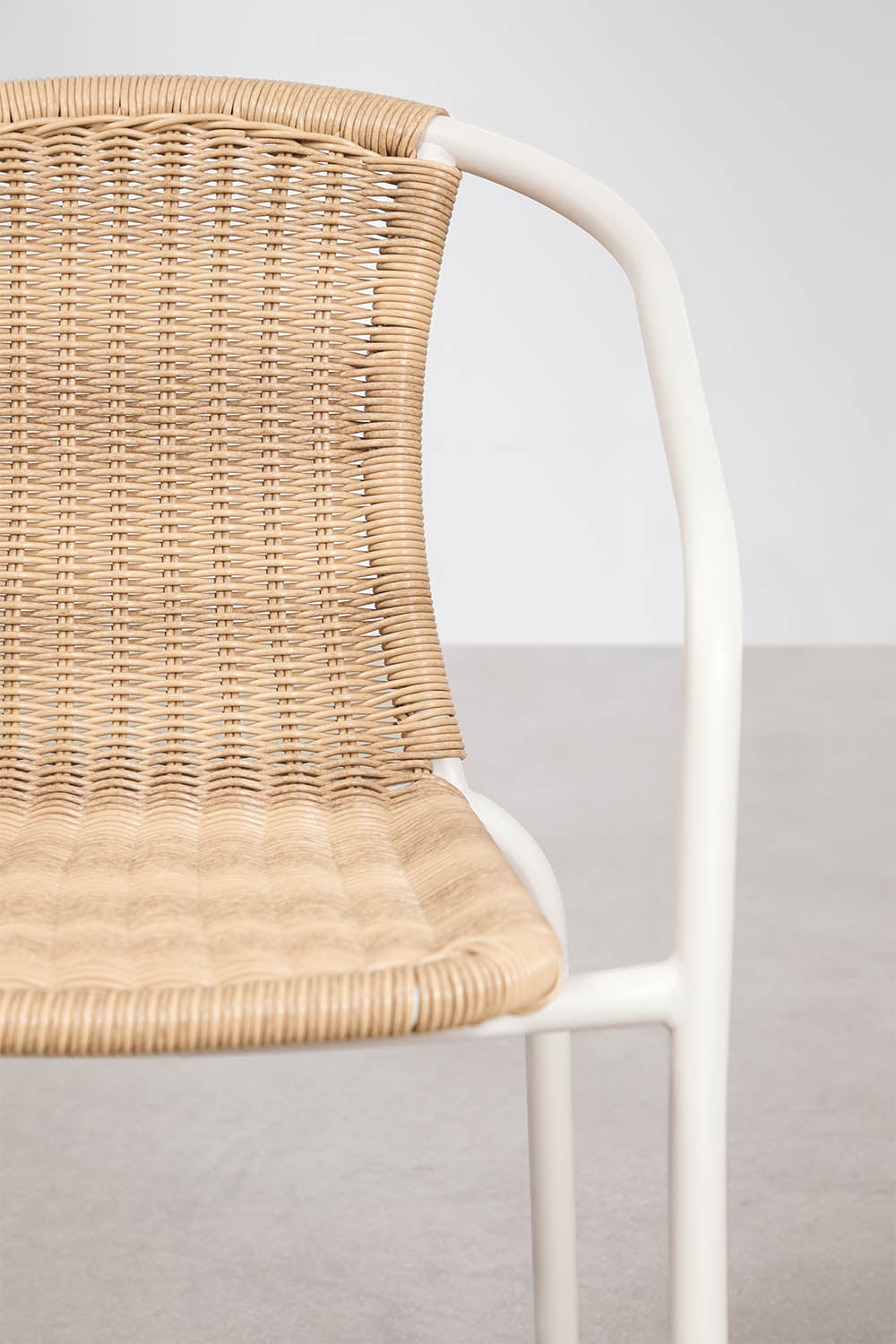 Round table set Ø150 cm in Numira cement and 8 stackable garden chairs in steel and synthetic rattan Kalymana, gallery image 10