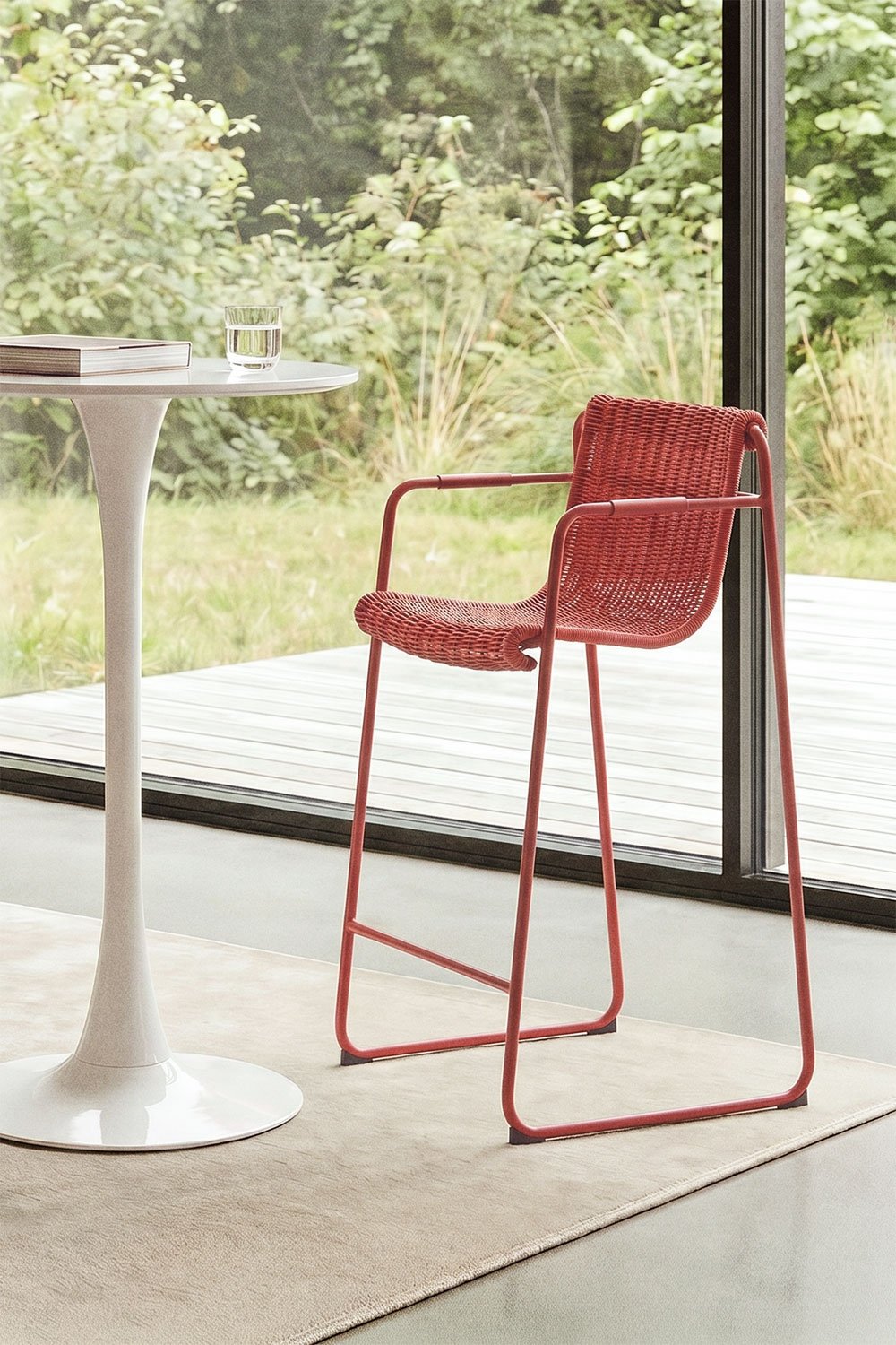 Stackable high stool with armrests in synthetic rattan and steel Revia, gallery image 1