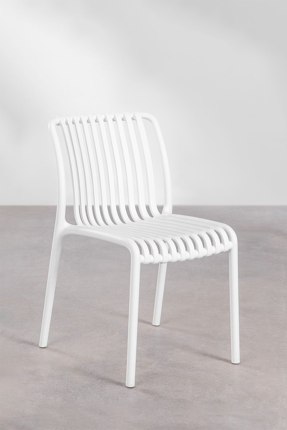 White plastic store stacking garden chairs