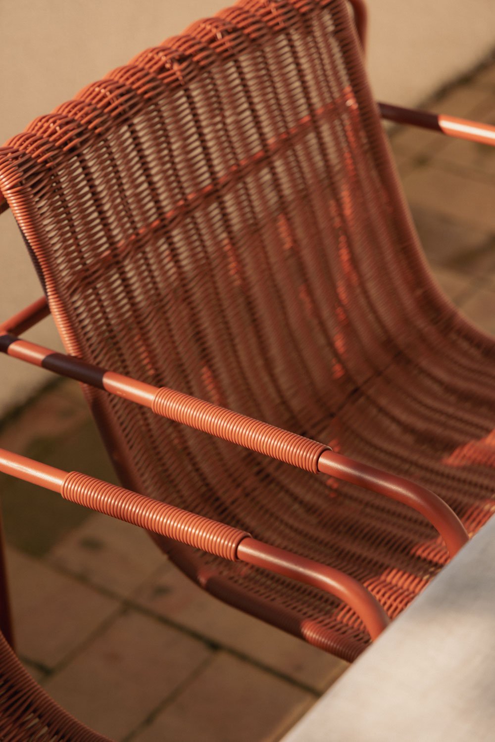 Stackable garden chair with armrests in synthetic rattan and steel Revia, gallery image 2