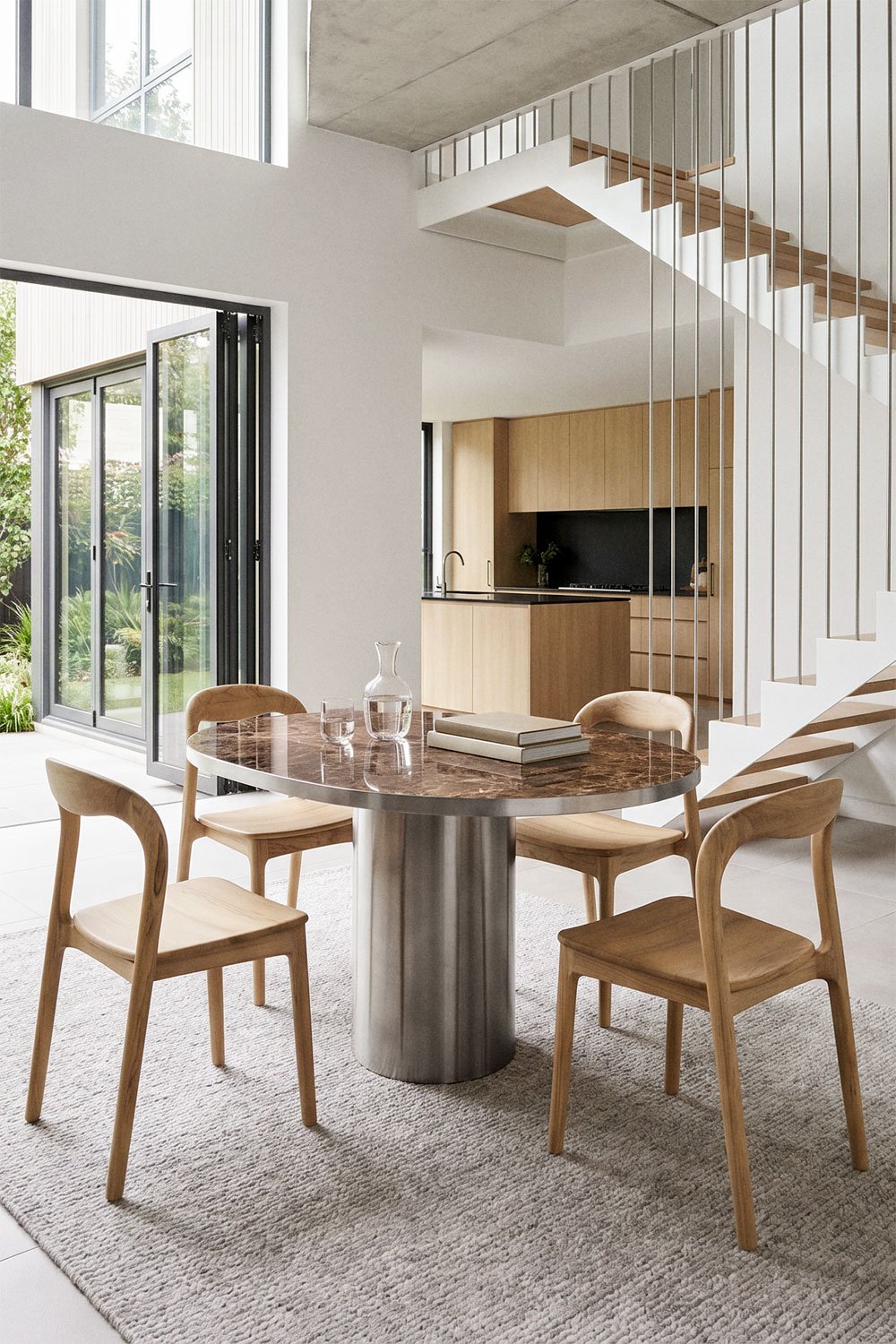 Fertrix oval dining table 120x100 cm in natural stone and stainless steel, gallery image 1