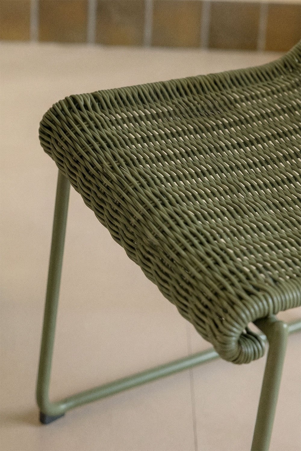 Stackable dining chair with armrests in synthetic rattan and steel Revia, gallery image 2