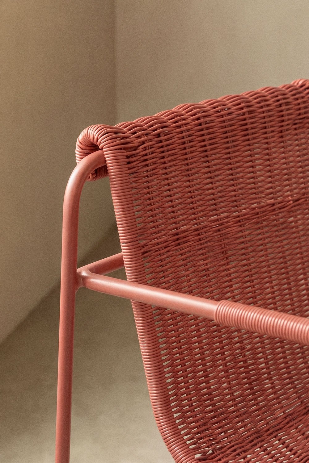 Stackable dining chair with armrests in synthetic rattan and steel Revia, gallery image 2