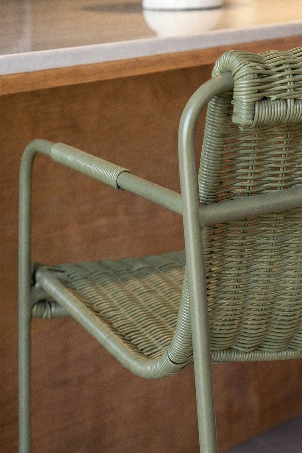 Stackable high stool with armrests in synthetic rattan and steel Revia, gallery image 2