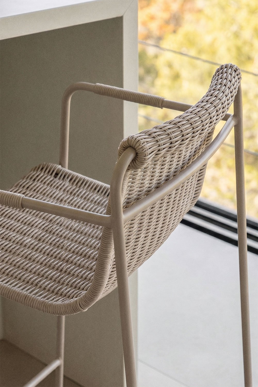 Stackable high stool with armrests in synthetic rattan and steel Revia, gallery image 2