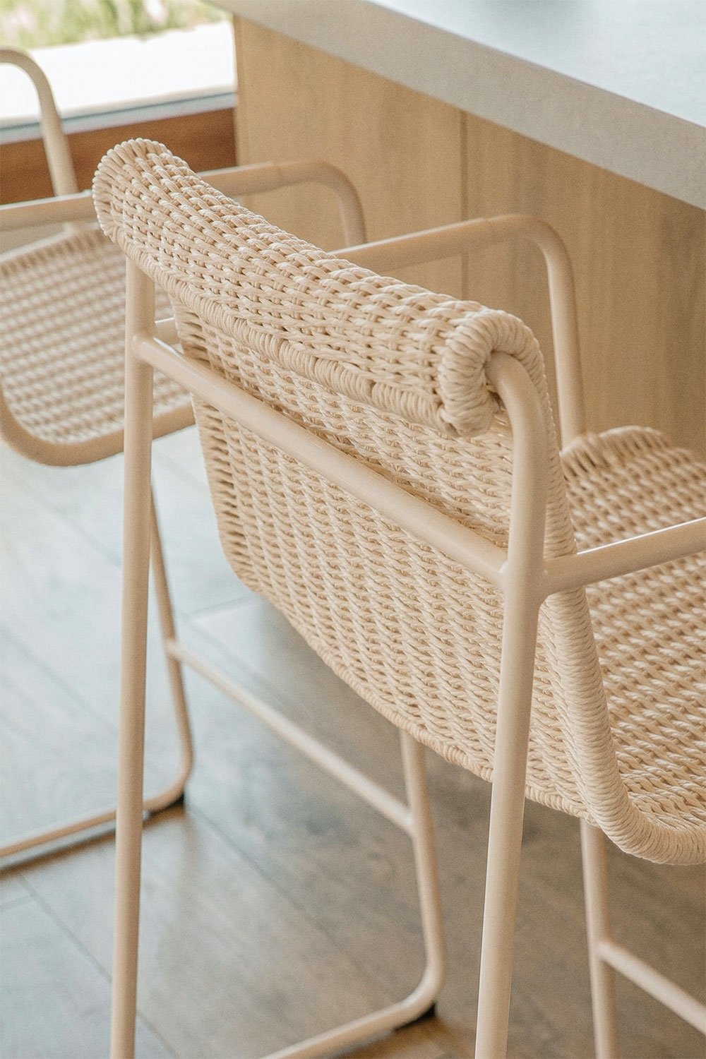 Stackable high stool with armrests in synthetic rattan and steel Revia, gallery image 2