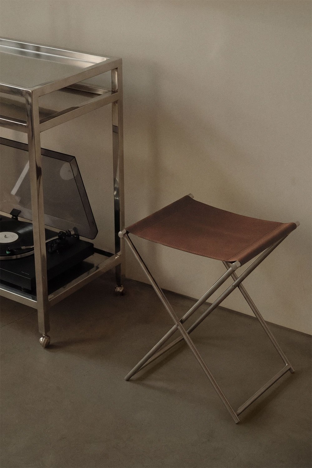Dravena 50 cm low folding stool in leather and stainless steel, gallery image 1
